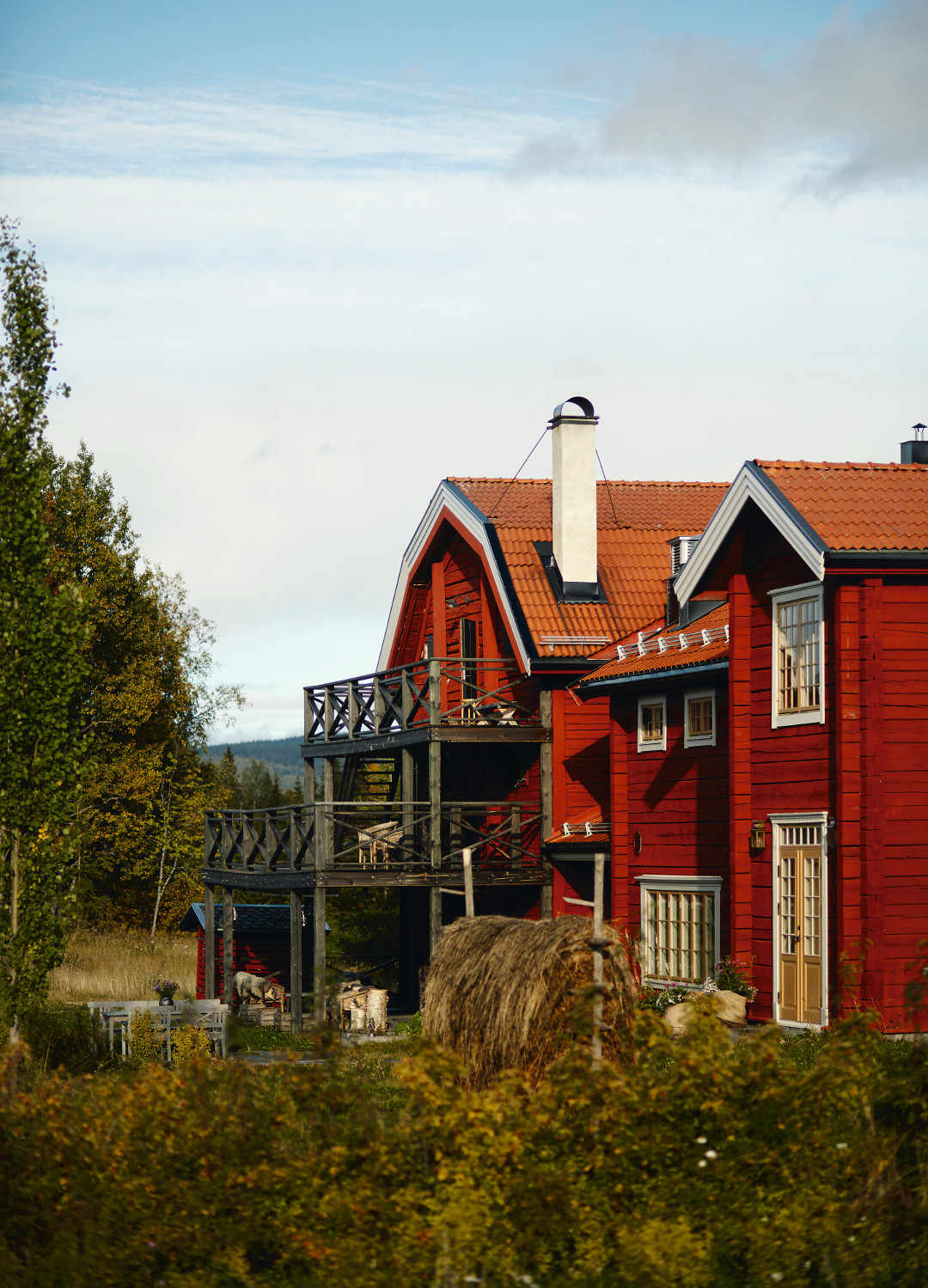 The restaurant in late summer with hay drying in the wind on a traditional hay fence. Photograph by Erik Olsson