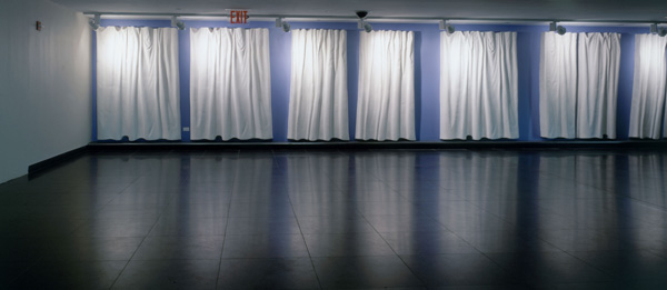 Curtain Wall (2001) 600' linear relief sculpture, modified gypsum, pictured on site - John F. Kennedy Airport, International Air Terminal, Terminal 4. Image courtesy of the artist.