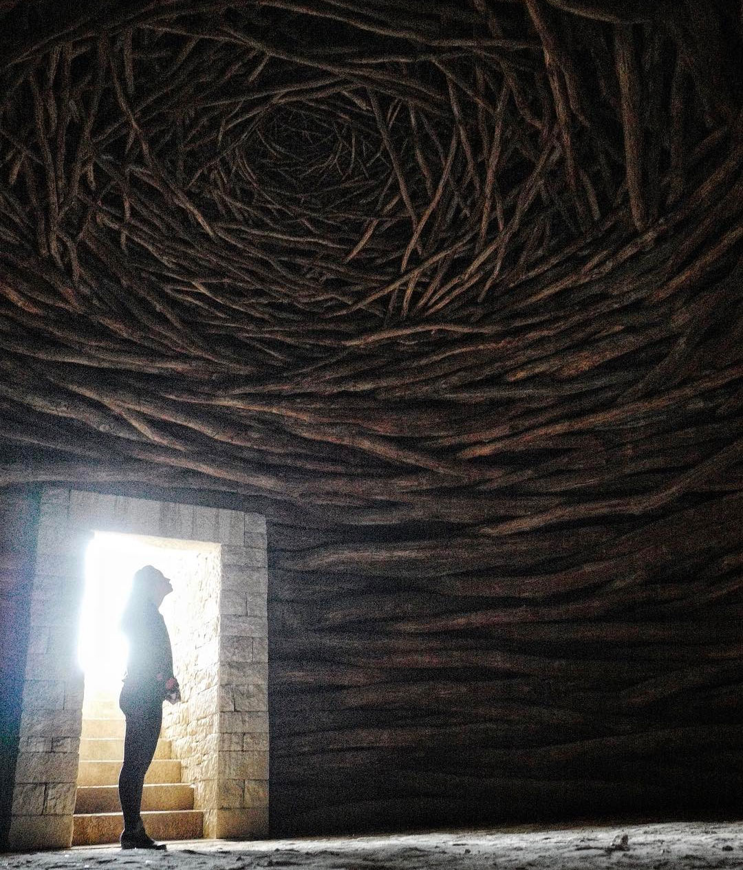 JR inside an Andy Goldsworthy work at Château La Coste, with Jordan Hewson. Image courtesy of JR's Instagram