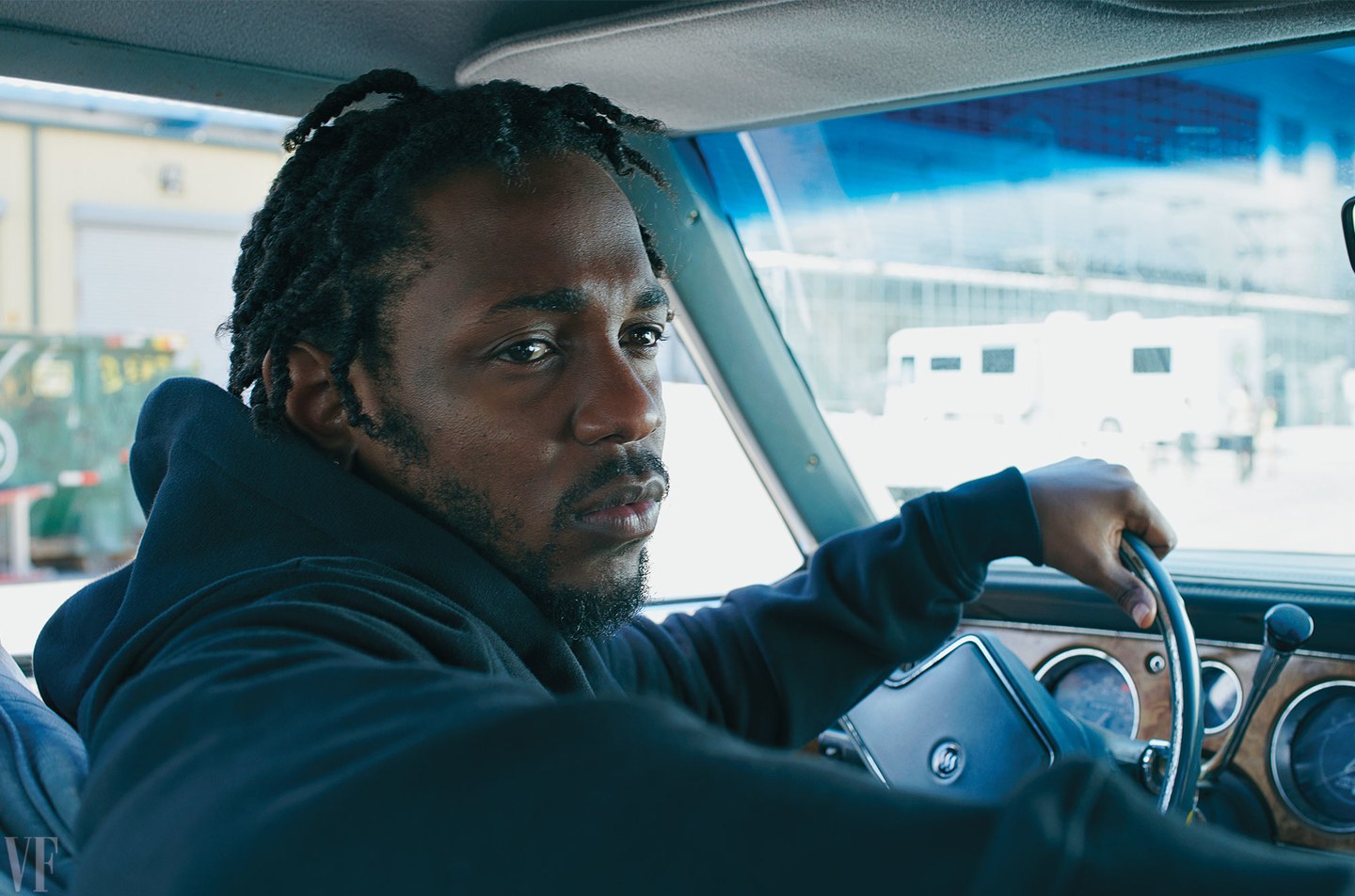 Kendrick Lamar in a 1985 Buick LeSabre outside the New York Expo Center, in the Bronx. Lamar wears a hoodie by Saint Laurent by Anthony Vaccarello. Lamar in a 1985 Buick LeSabre outside the New York Expo Center, in the Bronx. Lamar wears a hoodie by Saint Laurent by Anthony Vaccarello. Photograph by Annie Leibovitz