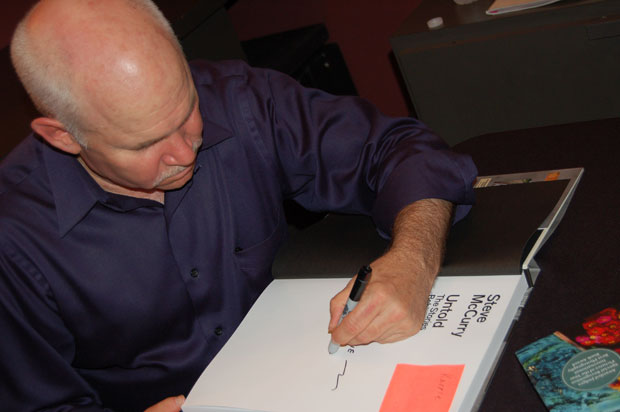 Steve signing a copy of Untold at his Peter Fetterman Gallery appearance and talk last night (Tuesday)